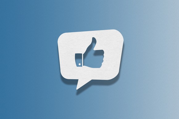 White speech bubble with a blue thumbs up on a blue background.