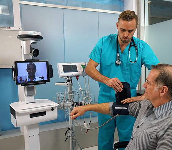 Patient and clinician using the InTouch Vici system