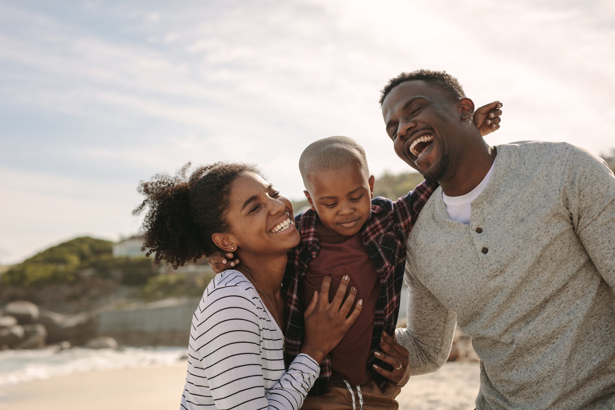 Young family having fun at the beach
