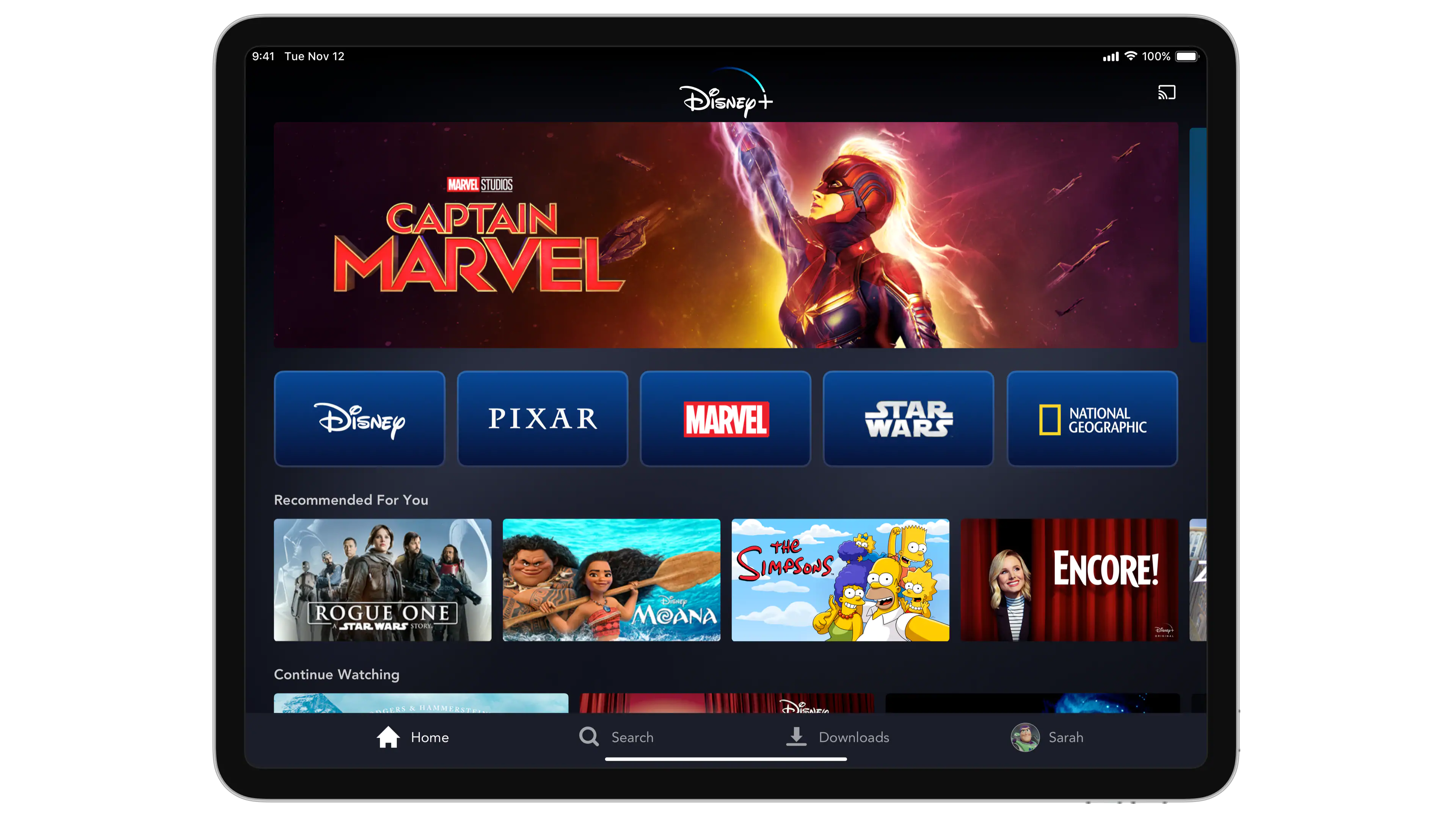 The Disney+ home page featuring Captain Marvel show on a tablet.