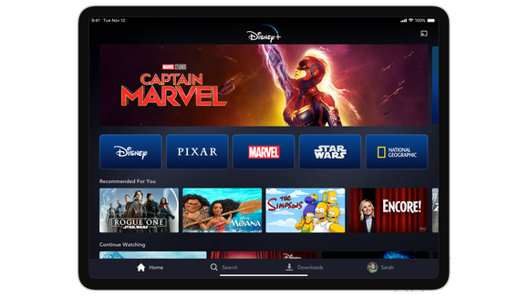 The Disney+ home page featuring Captain Marvel show on a tablet.