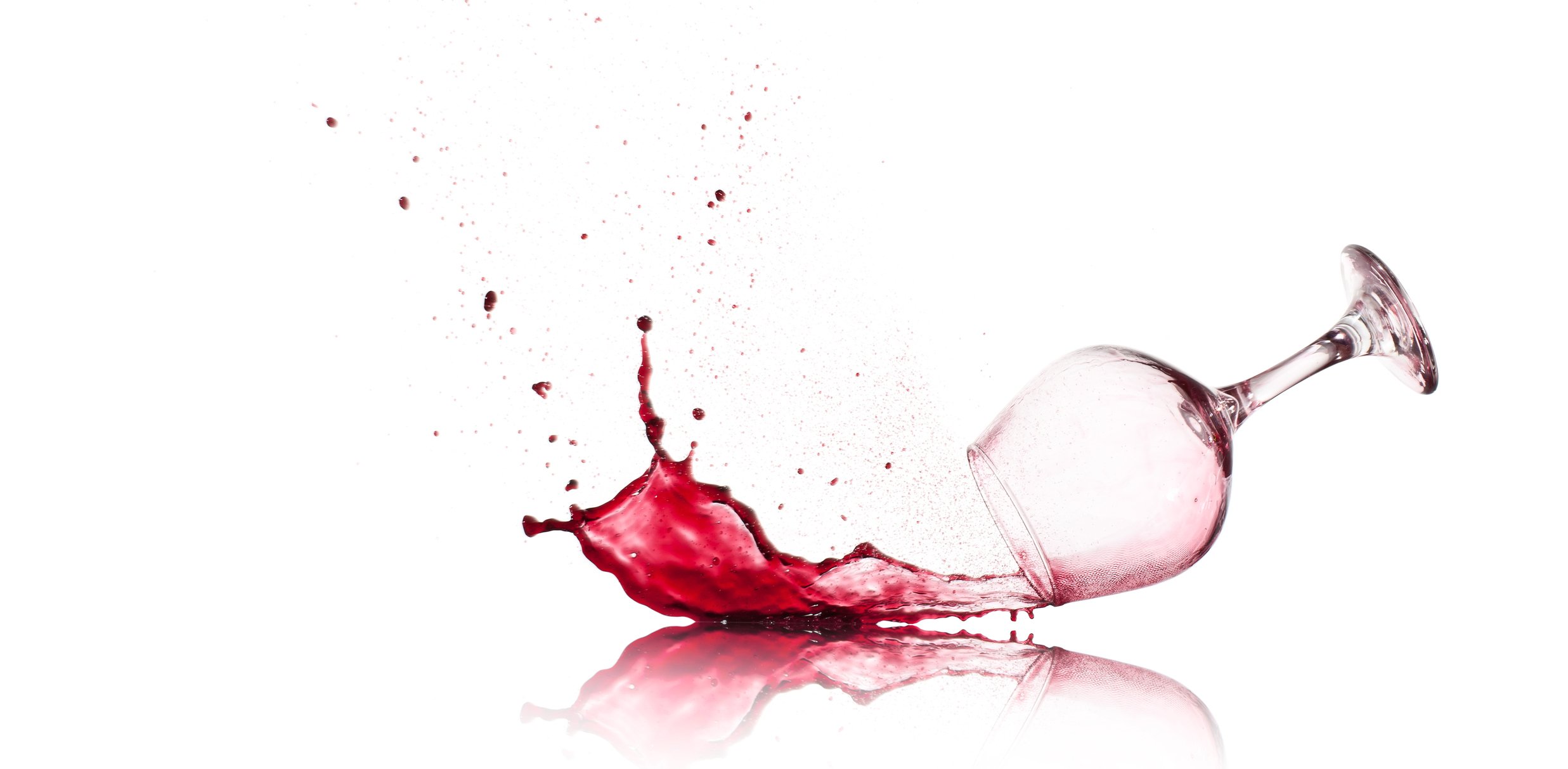 Glass of wine spilling