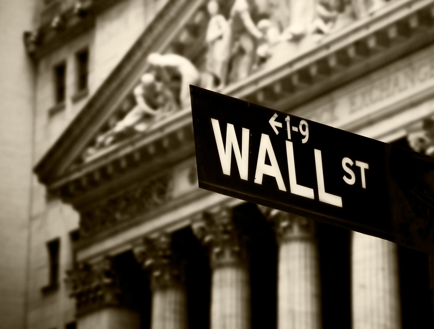 Wall Street sign in front of the New York Stock Exchange.