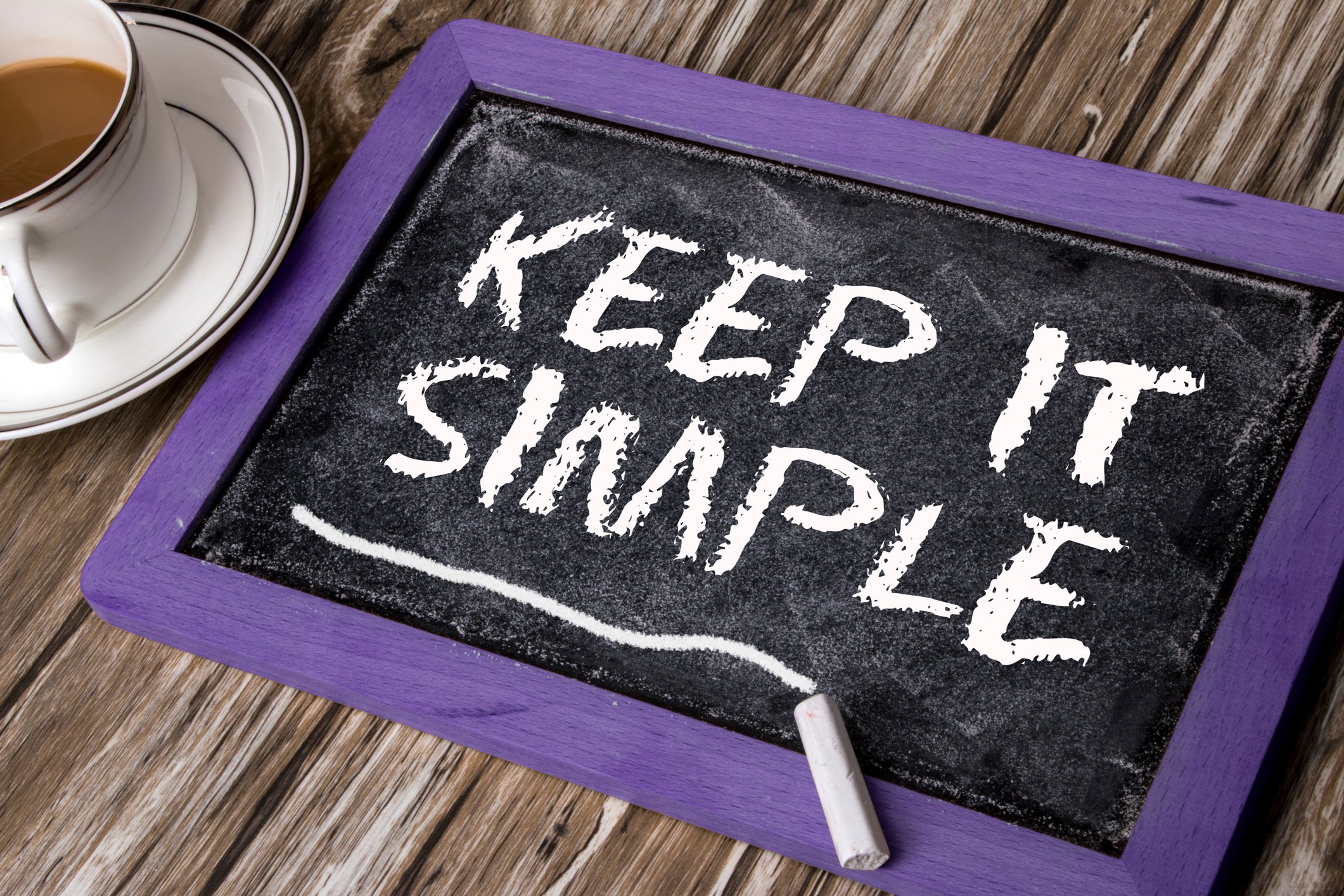 Chalk tablet with "Keep it simple" written on it