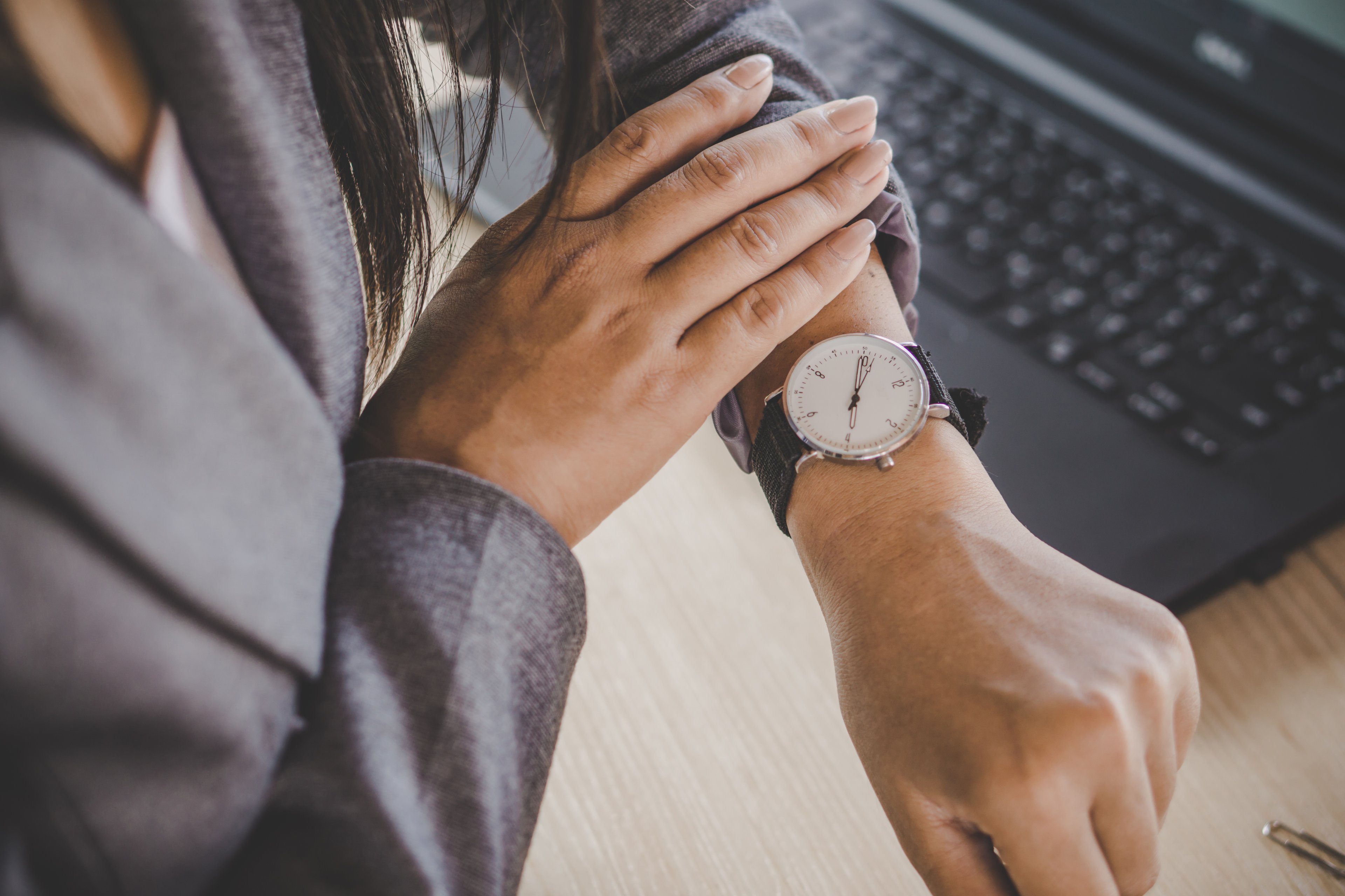 A person checks their watch