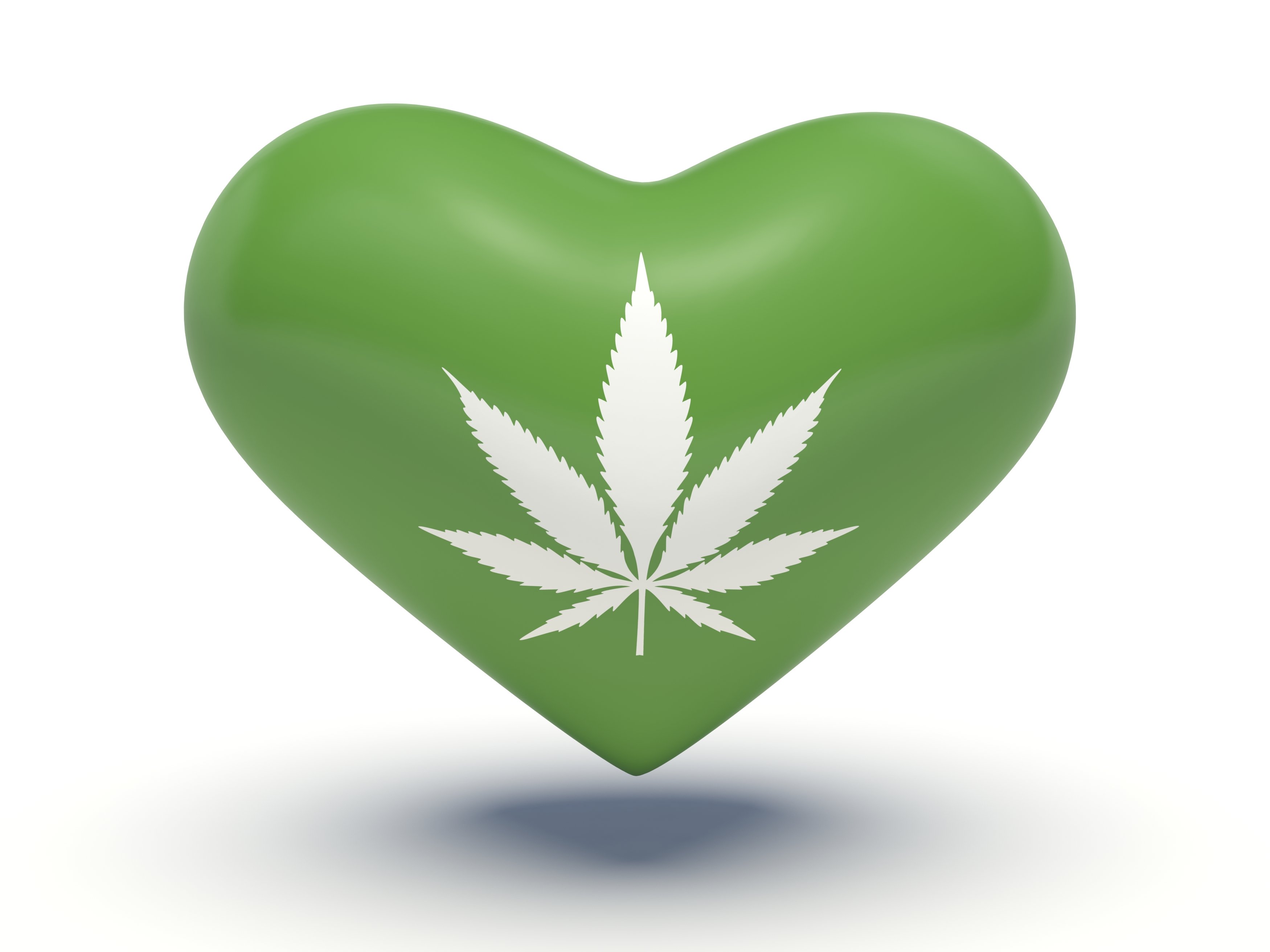 White marijuana leaf printed on a green heart.
