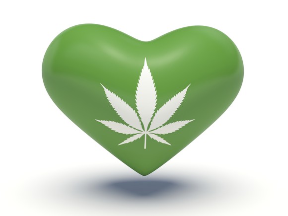 White marijuana leaf printed on a green heart.