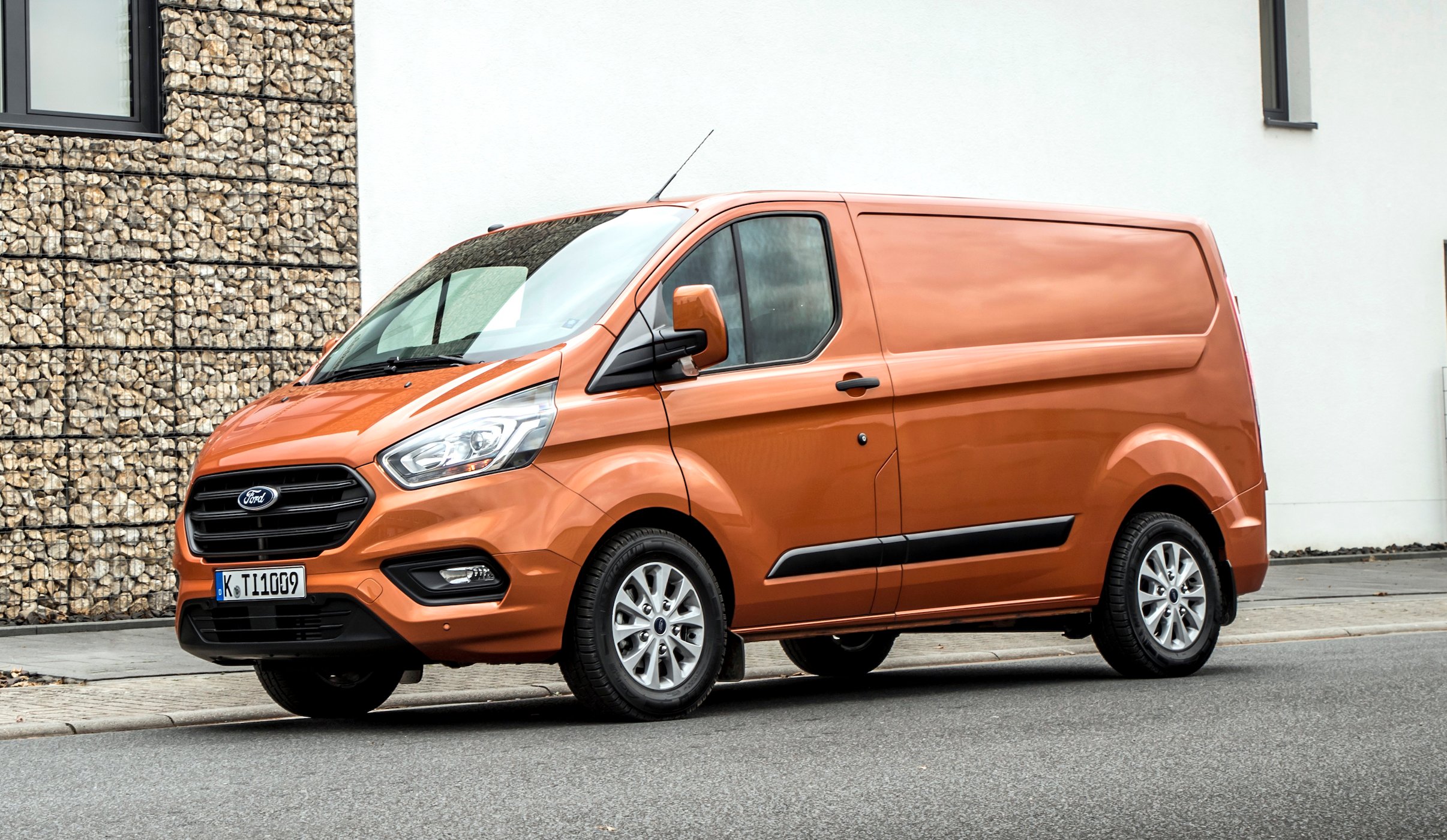An orange Ford Transit Custom commercial van.