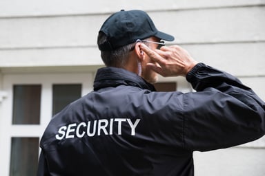 security guard using earpiece