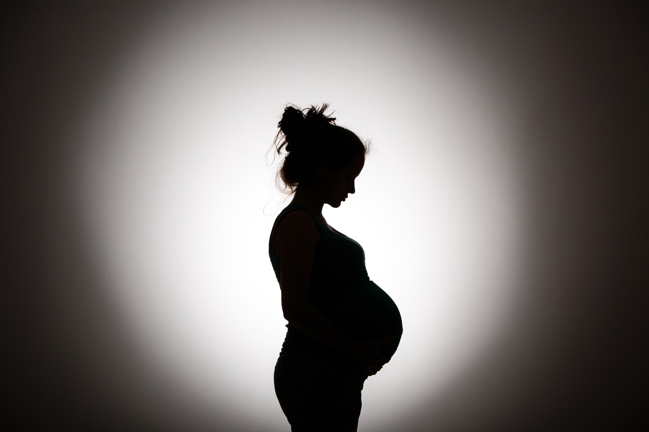 Silhouette of pregnant woman.