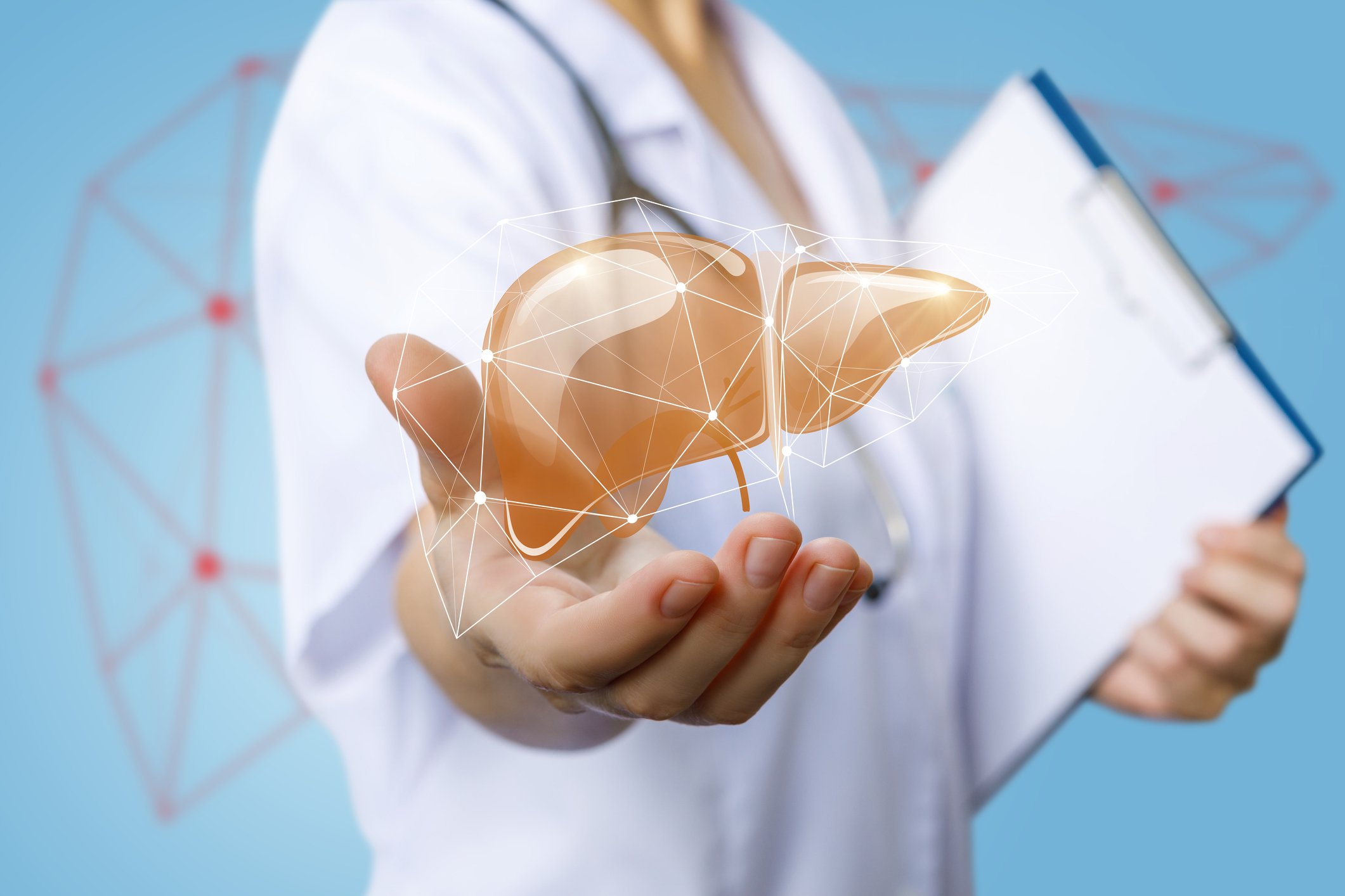 Liver image floating above hand of doctor holding clipboard.