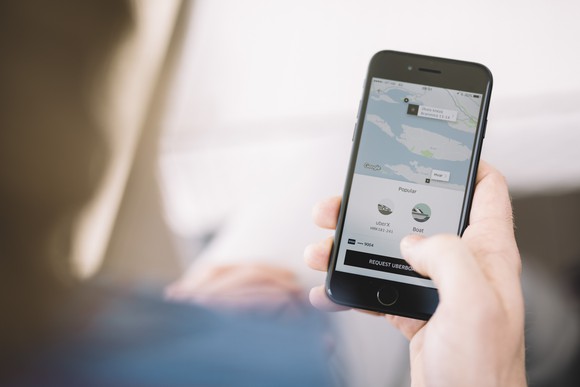 Someone hailing an Uber ride using the smartphone app.