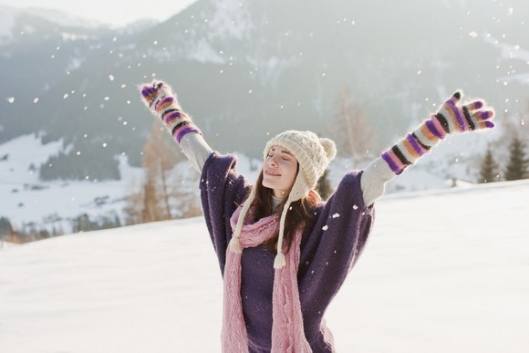Woman outside enjoying the snow