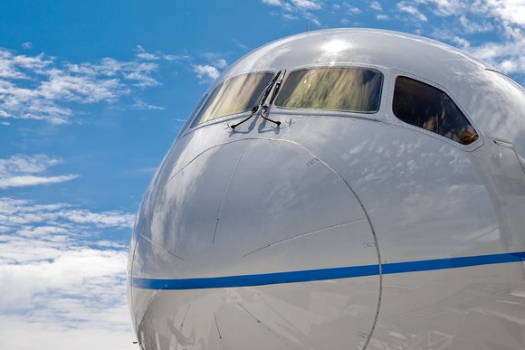 Close up of the nose of a Boeing 787 Dreamliner commercial jet airliner.