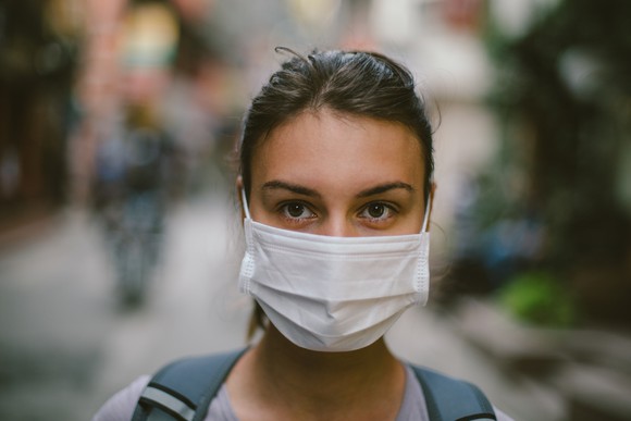 A woman wearing a face mask.