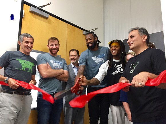 CEO Ethan Brown pictured next to executives and investors.