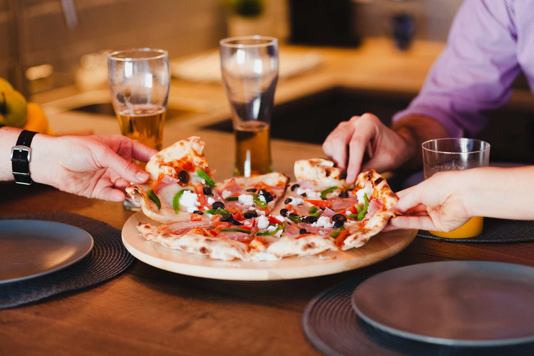 Friends sharing a pizza.