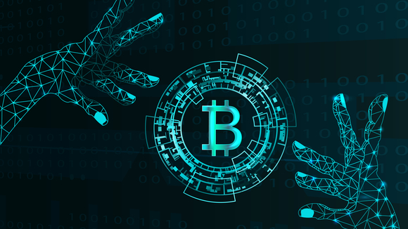 Two digital hands surround a digital Bitcoin emblem.