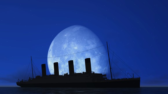 Silhouette of the HMS Titanic with the moon looming large in the background