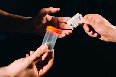An illicit marijuana purchase taking place