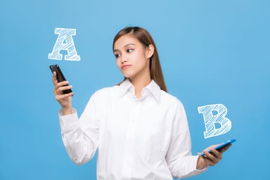 woman choosing between phones