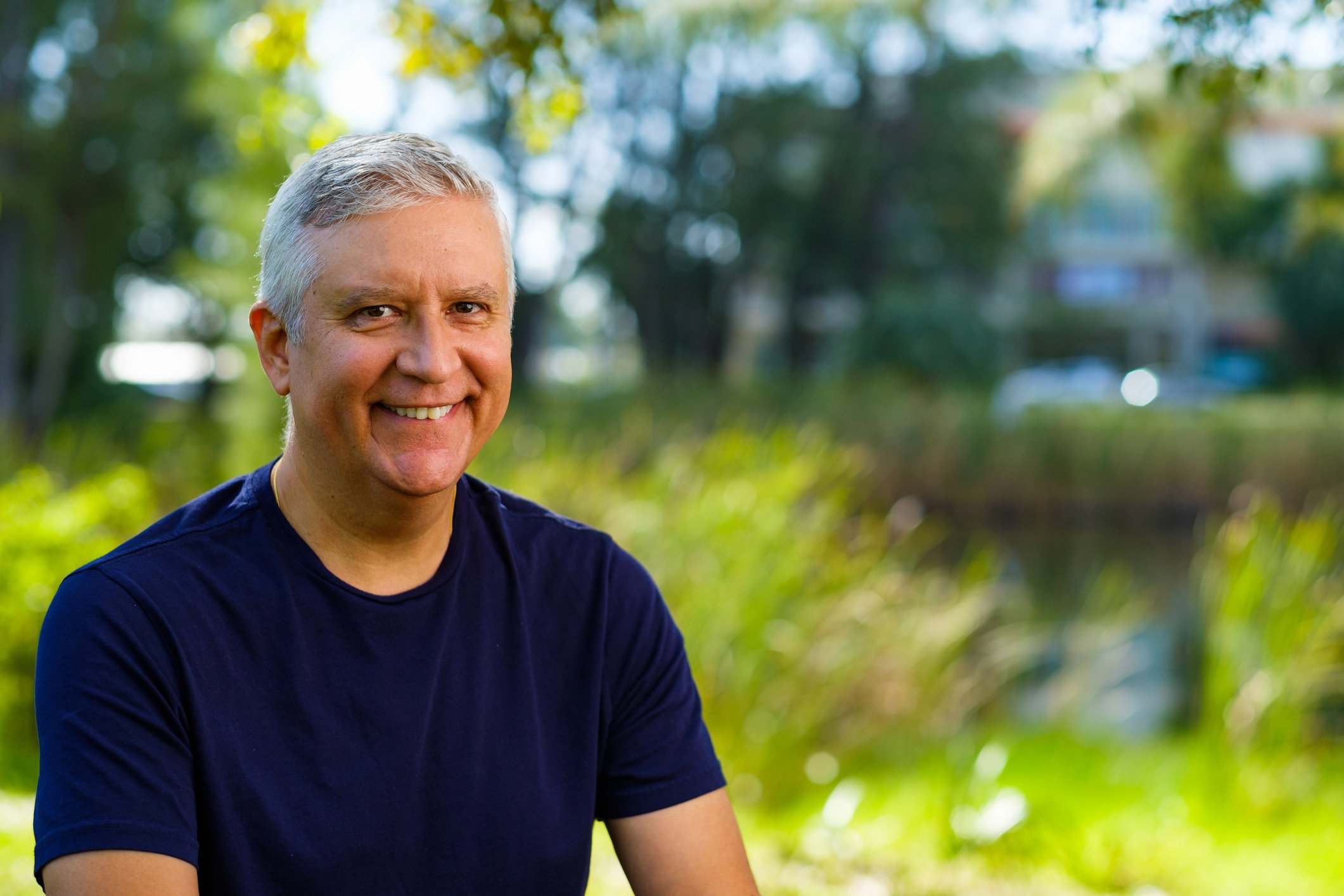 Smiling older man outdoors.