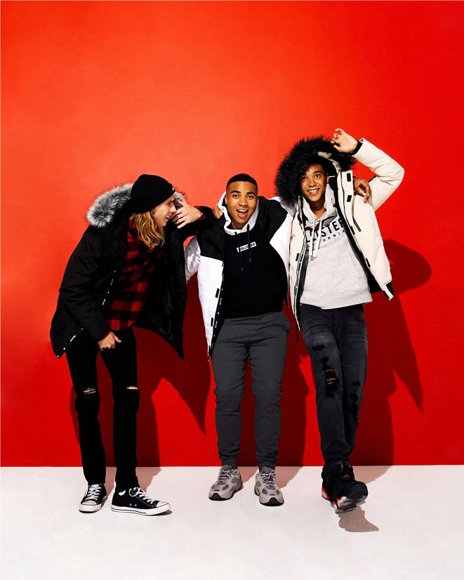 Three men wearing Hollister apparel.