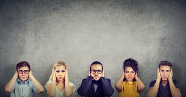 people ignoring with hands over ears