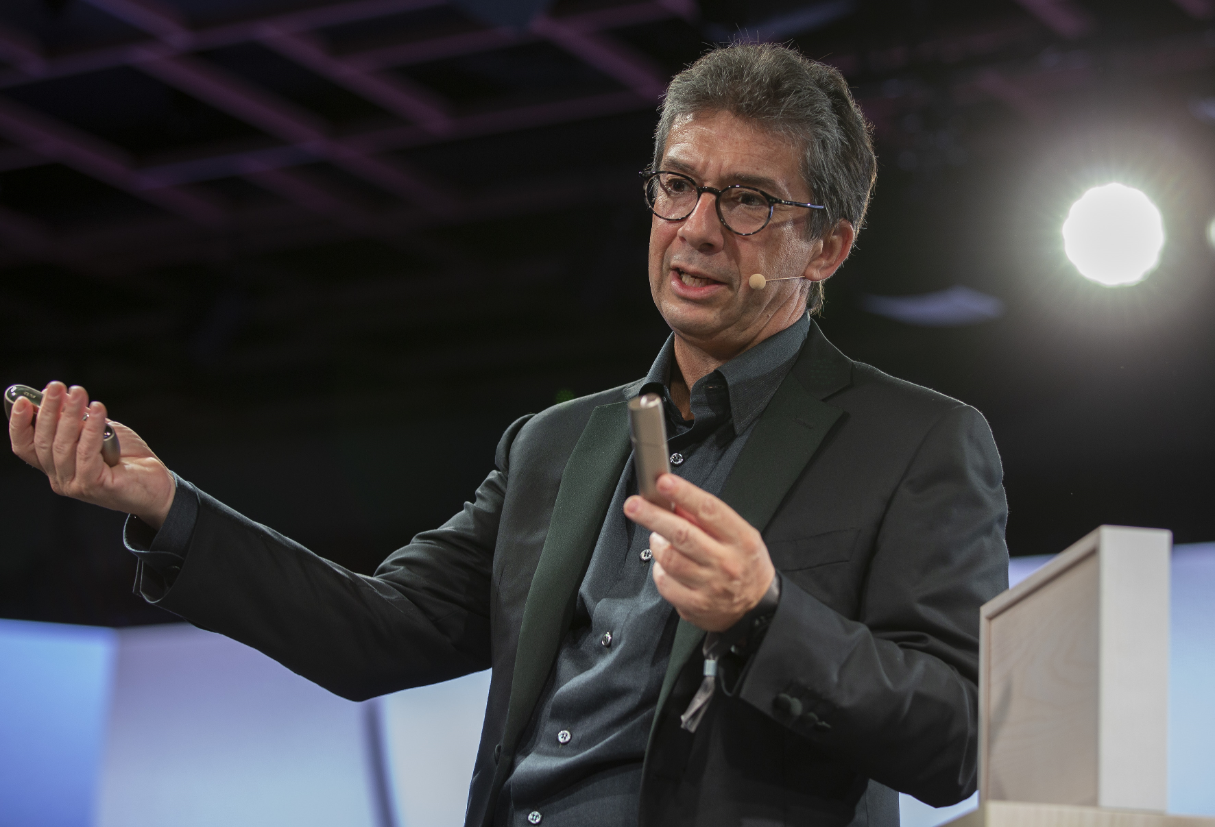 Philip Morris CEO Andres Calantzopoulos with an IQOS device