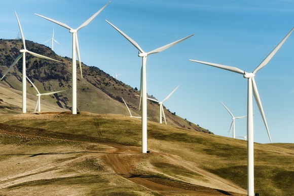 Wind turbines on a hill.