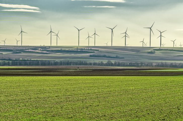 Wind turbines on a hill in the distance.