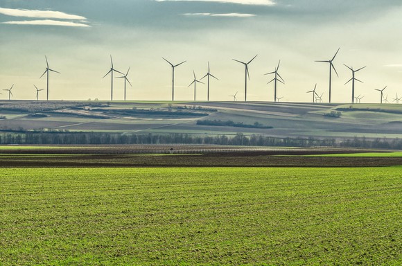Wind turbines on a hill in the distance.