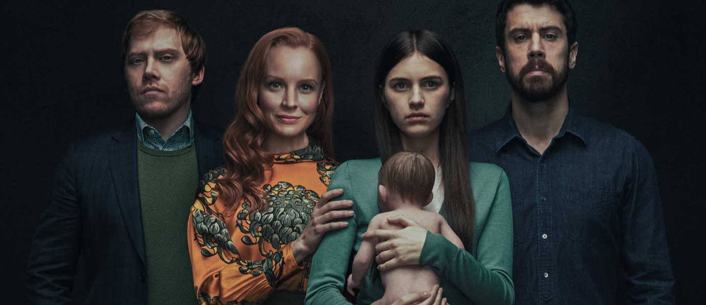 The cast of Servant on Apple TV+ holding a baby.
