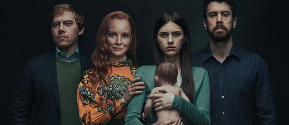 The cast of Servant on Apple TV+ holding a baby.