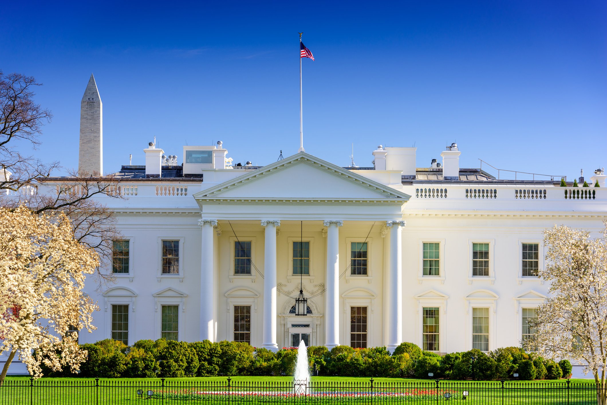 White House as seen from north, with Washington Monument in background.