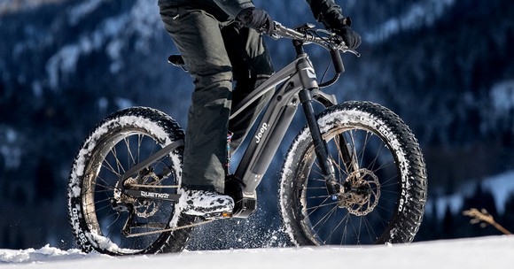 Rider on e-bike in the snow.