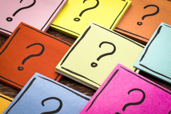 Sticky notes with question marks drawn on them.