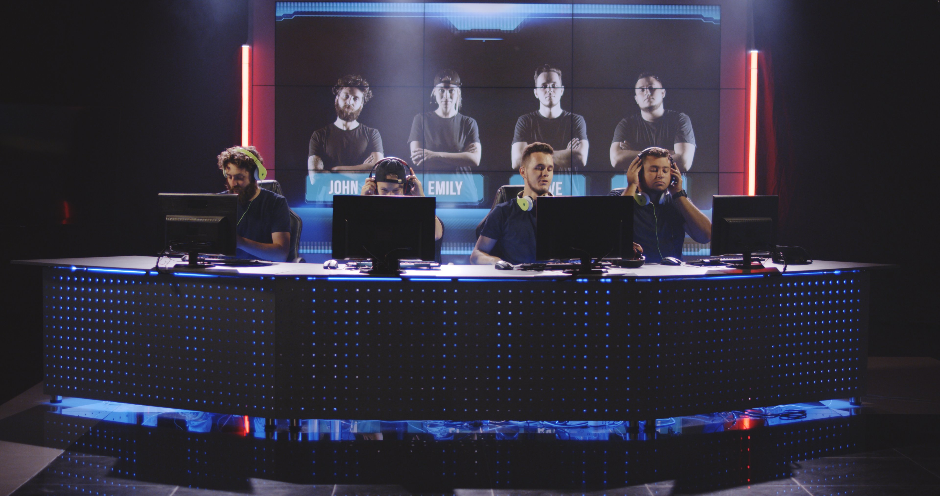 Esports players in front of gaming computers. 