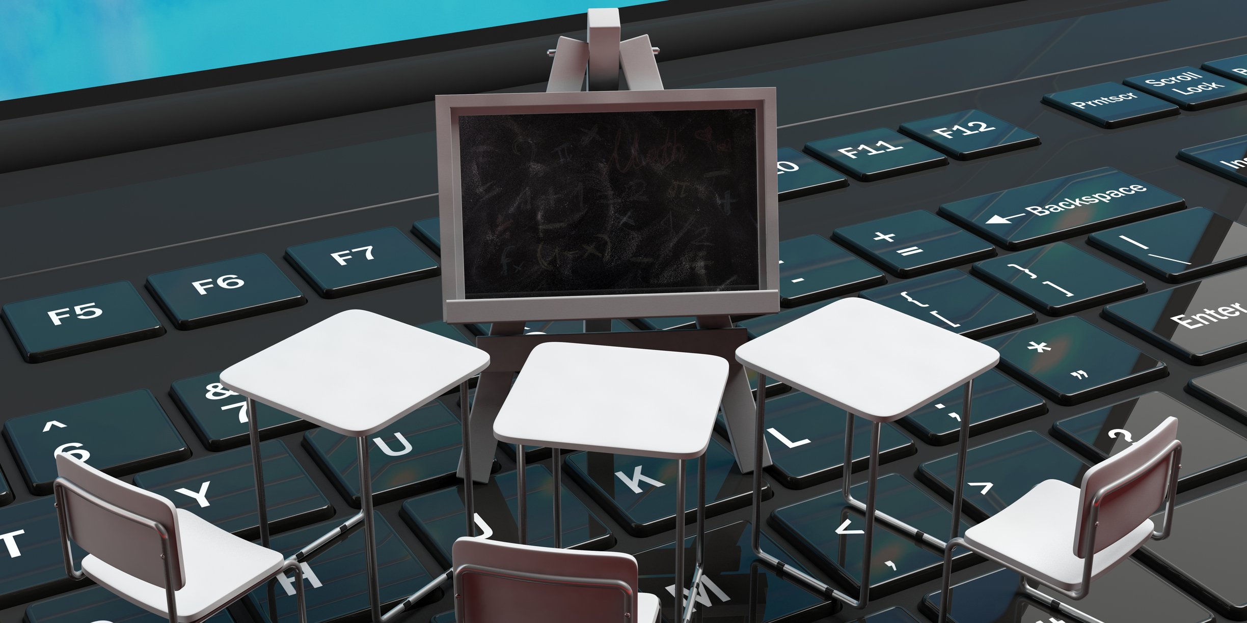 Tiny chairs and a blackboard, placed on a laptop keyboard.