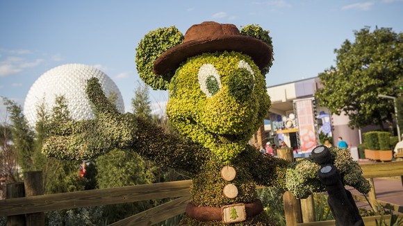 A Mickey Mouse topiary at Epcot during a garden festival.