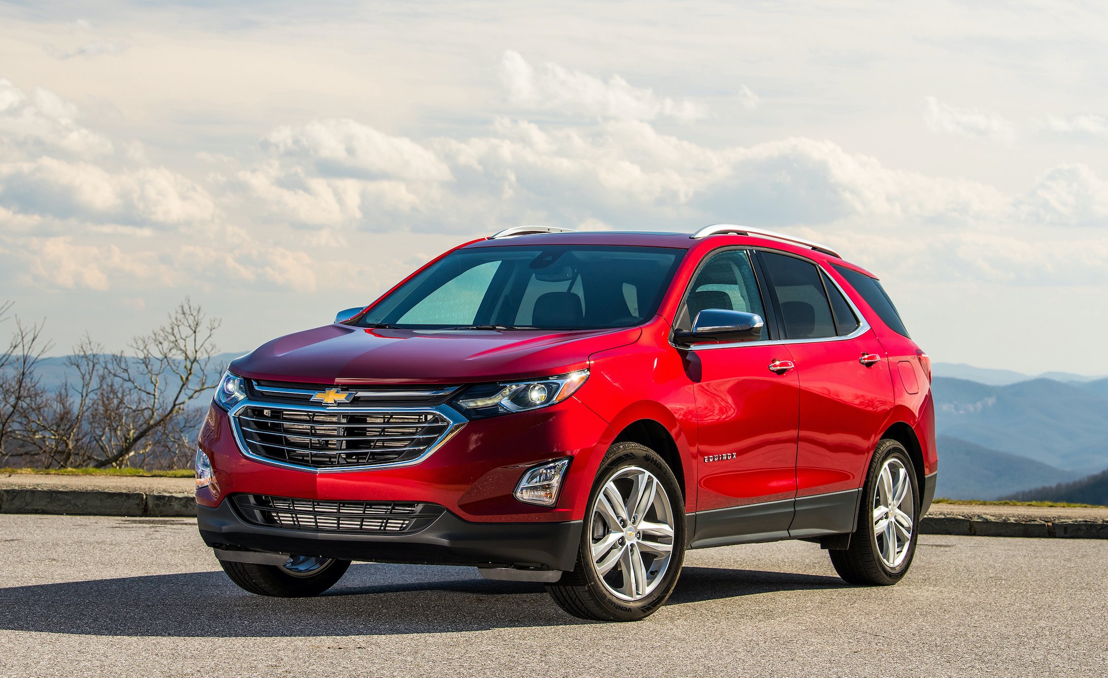 A red 2020 Chevrolet Equinox, a compact crossover SUV