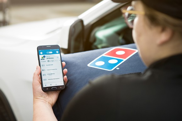 Domino's driver using GPS for delivery instructions