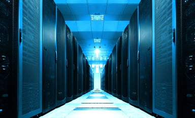 A long server room with data center equipment