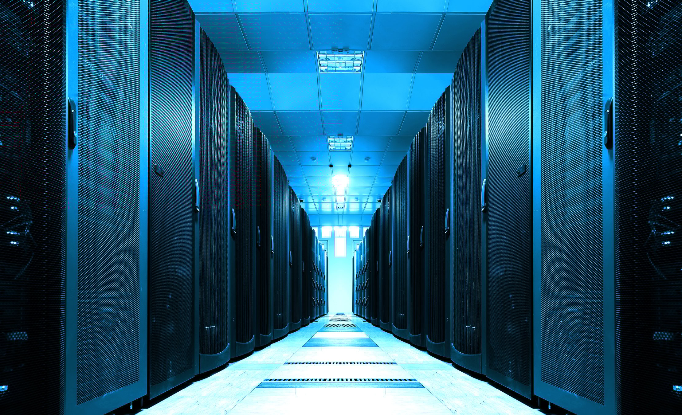 A long server room with data center equipment