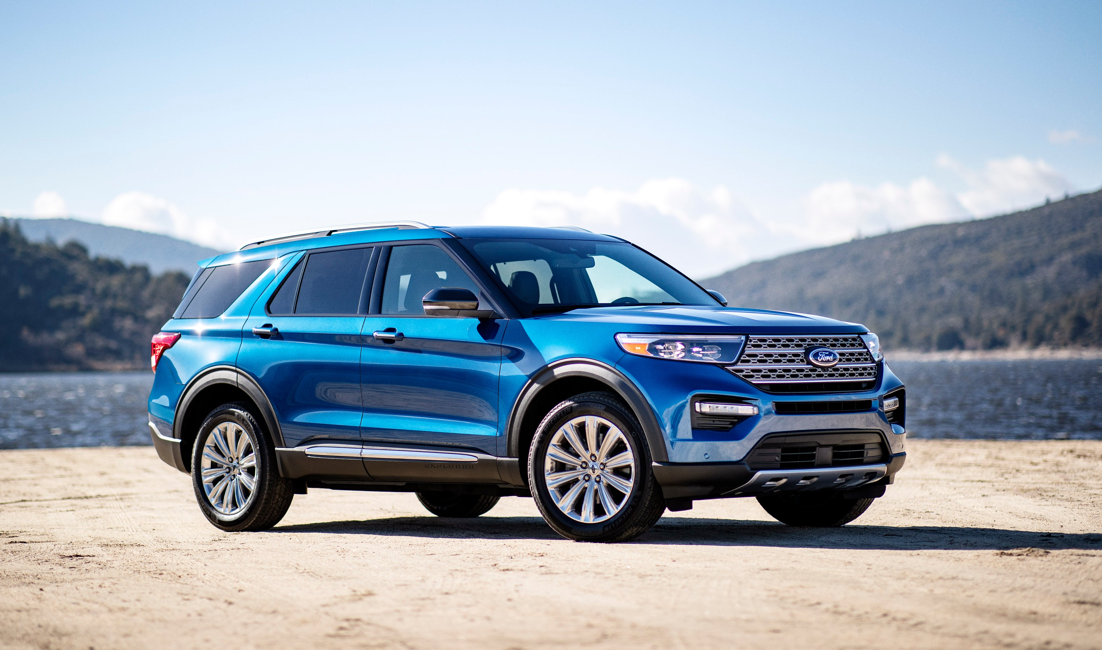 A blue 2020 Ford Explorer, a 7 passenger crossover SUV. 