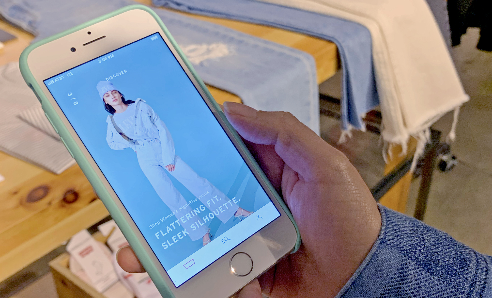 A smartphone with the new Levi's app displayed.
