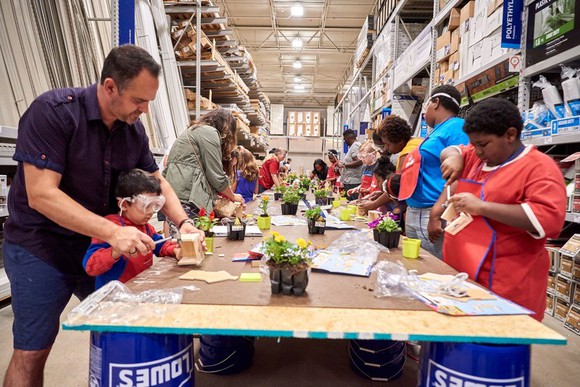 Families take part in a Lowe's workshop.