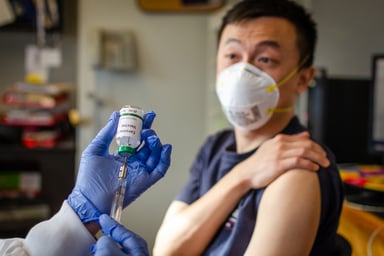 A Chinese man getting a coronavirus vaccine