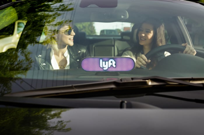 Two women in the front of a Lyft car.