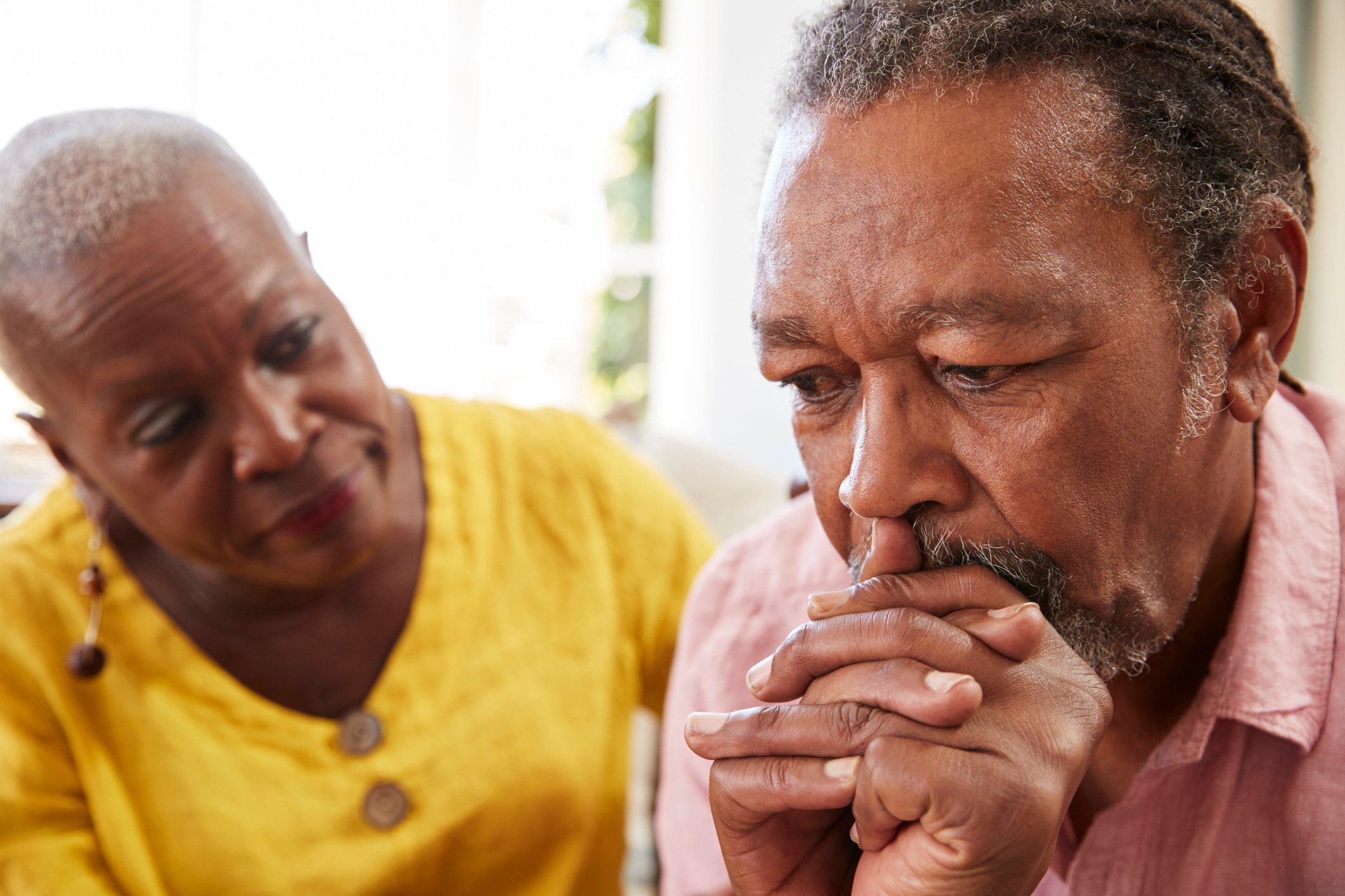 An older couple, looking worried.